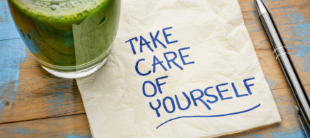 A napkin has been written on with blue ink and it reads "take care of yourself"