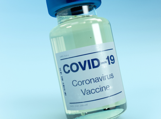 A small bottle of a COVID-19 vaccine